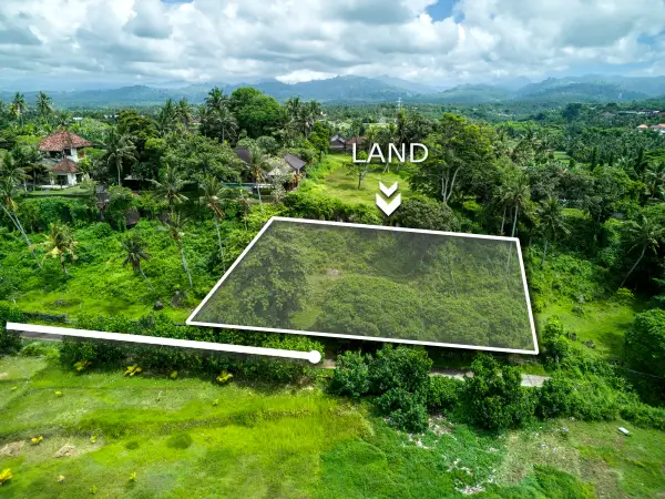 Aerial view of hillside 1,270m2 land for sale in Pulukan Bali surrounded by lush greenery with mountain backdrop