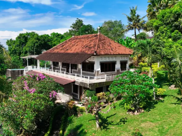 Traditional Balinese-style villa surrounded by tropical gardens in Pulukan, West Bali