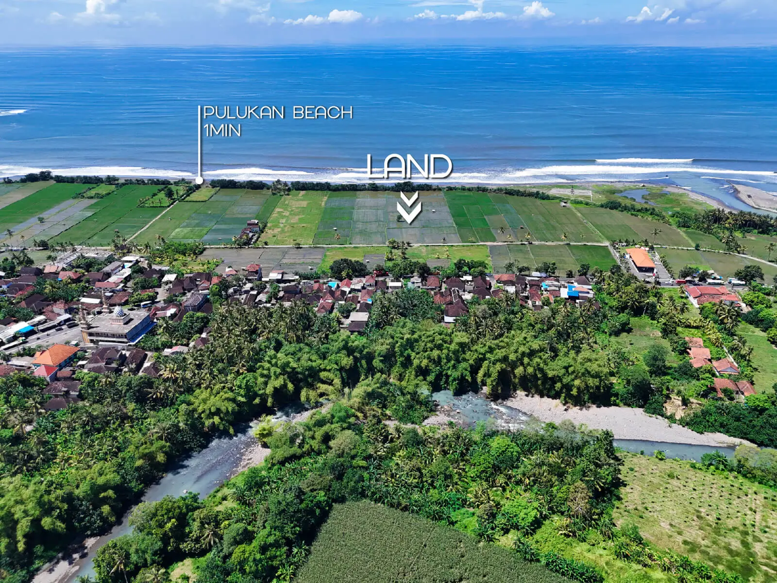 Drone view showing land for sale in West Bali located 1 minute from Pulukan Beach, bordered by rice terraces and village houses with ocean frontage