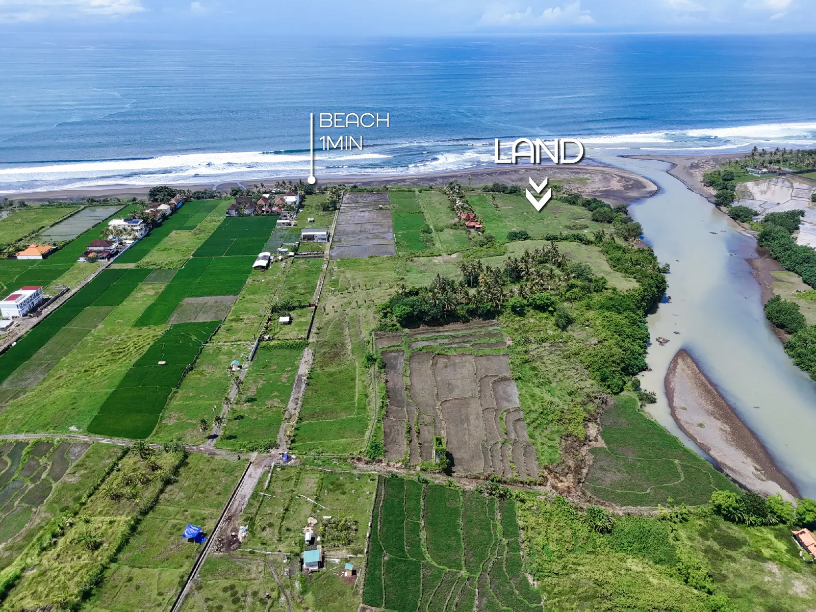 yehsumbul 2-00004 Aerial view of West Bali showing a 1-minute-to-beach land location surrounded by rice fields, river estuary, and long black-sand coastline