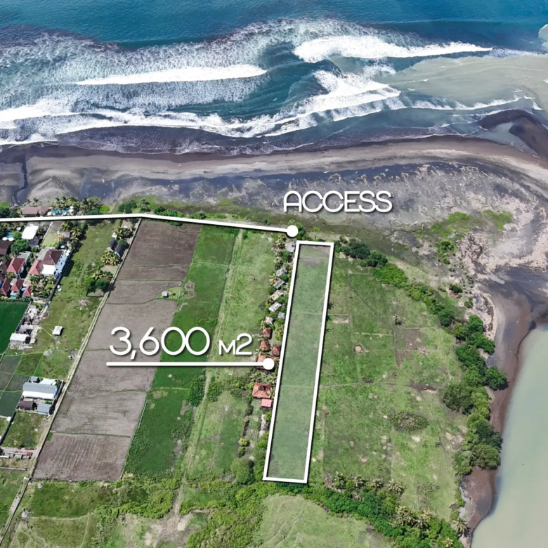 Top-down drone image marking a 3,600 m² beachfront land plot in West Bali, with direct access and panoramic ocean and river views