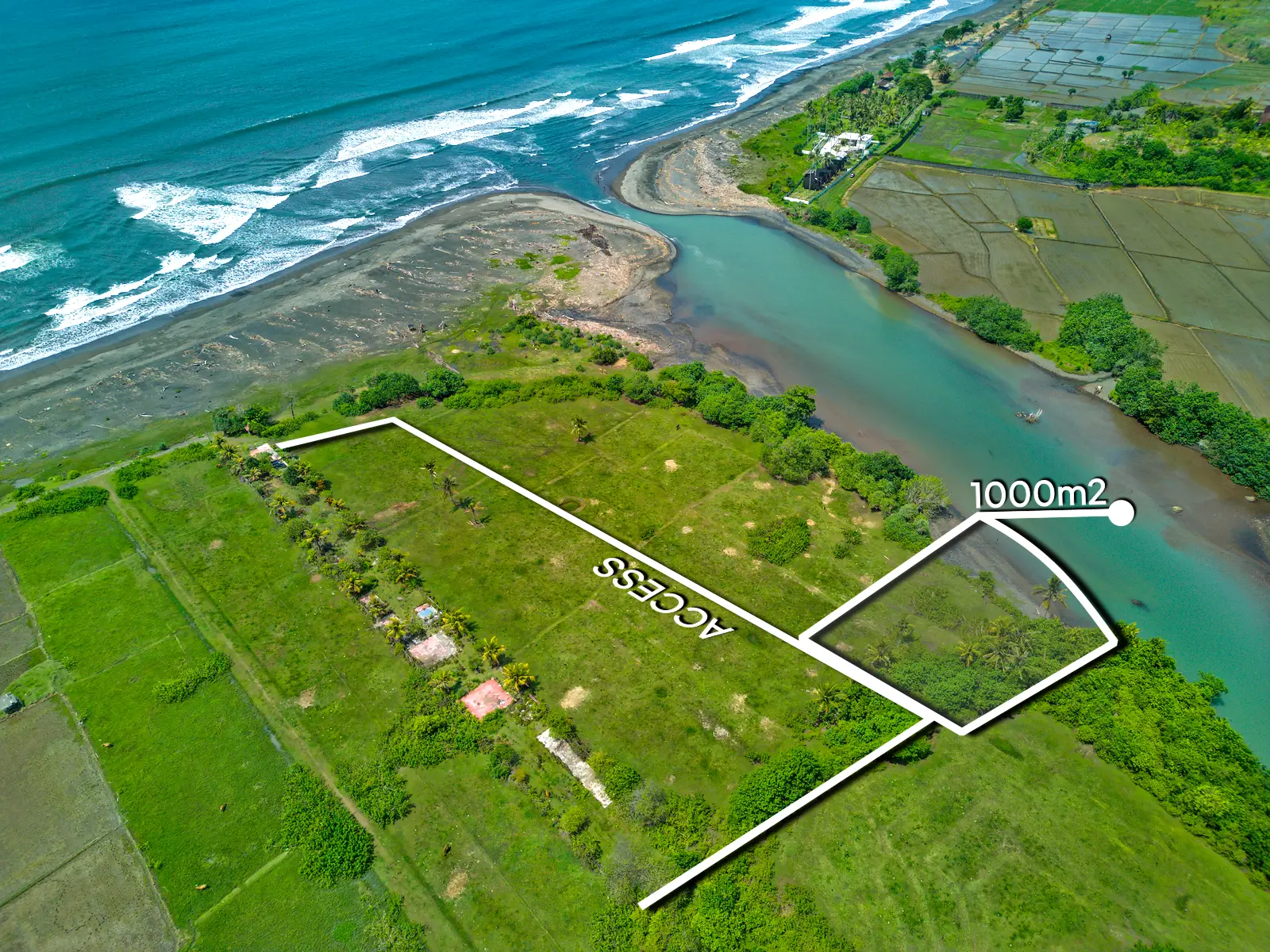 yehsumbul 5-5-00014 Top-down drone image of a 1,000 m² beachfront lagoon-front land plot in West Bali, showing private access road, curved river boundary, and flat land ready for development.